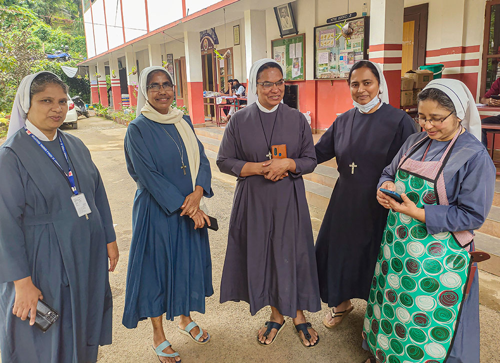 The Sisters of Maria Bambina stand in front of St. Joseph's School in Meppadi. The school is the site of a relief camp for the landslide victims of Wayanad, Kerala, southwestern India. From left are Sr. Kuruna Alex, Sr. Sherly Joseph, Sr. Joicy Joseph, Sr. Luxy James and Sr. Binu Ann, superior. (Thomas Scaria) 