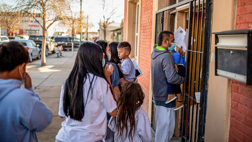 A migrant family is dropped off Dec. 13, 2022, at a migrant shelter run by Annunciation House in downtown El Paso, Texas. (OSV News/Reuters/Ivan Pierre Aguirre)