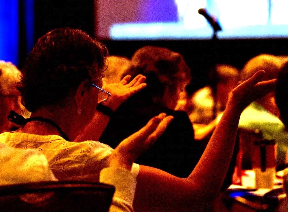 Participants at the 2023 Leadership Conference of Women Religious assembly bless the speakers during the gathering in Dallas.