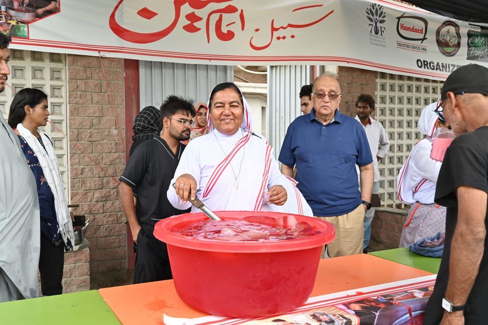 Sr. Fazilat Inayat prepares chilled sharbet. 