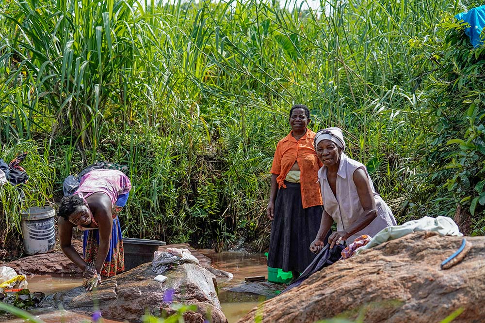 Women wash clothes at the stream in Konzalendo village in Malawi on Jan. 21, 2023. (Courtesy of Monica Ichife)