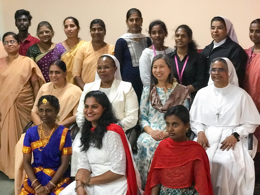 Nuns involved in youth-led initiatives, with assistance from the Hilton Foundation, in Bengaluru, southern India, pose for a photo with young people undergoing vocational training. (GSR photo/Thomas Scaria)