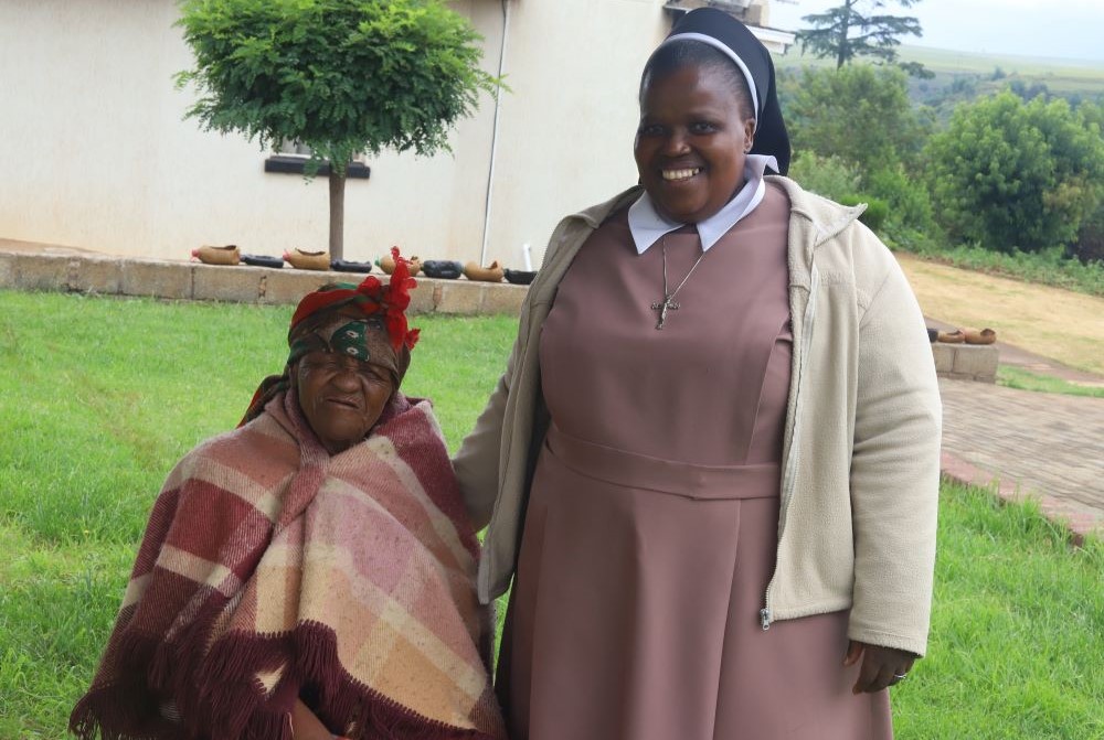 Sr. Theresia Ntsoaki Noko interacts with an elderly person at the Elizabeth Bruyere Old Age Home in Leribe, Lesotho. 