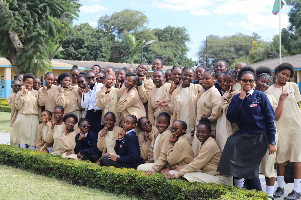 Sr. Angela Ngwenyufu, a member of the Handmaid Sisters of the Blessed Virgin Mary, poses for a photo with her students at St. Patrick's Secondary Girls School in Lusaka, Zambia, on May 25. (GSR photo/Doreen Ajiambo) 