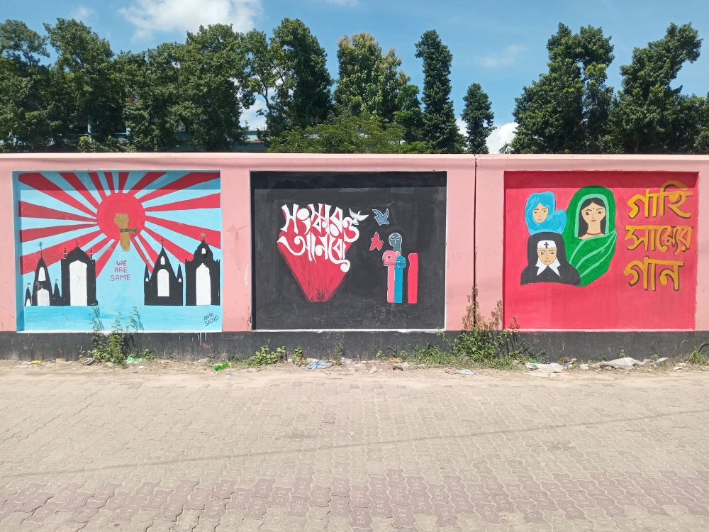 This wall in Dhaka includes messages from students that say, "We are the same" and that  although people in Bangladesh live with different faiths, together they will reform the country. (Sumon Corraya)