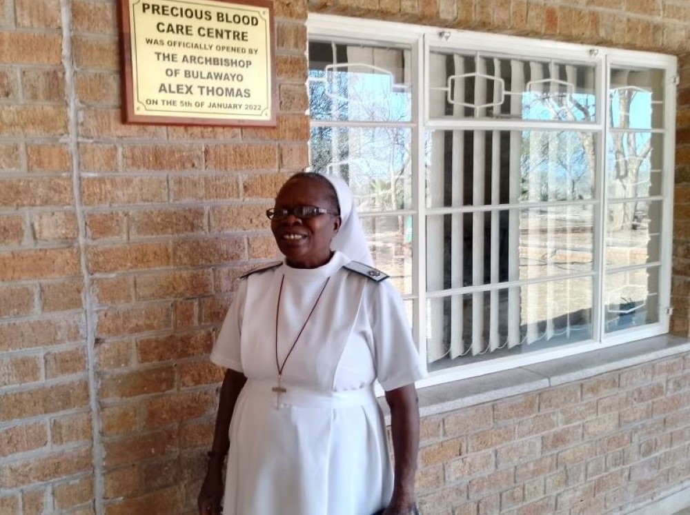 Precious Blood Sr. Caroline Busvumani stands at the entrance of the Precious Blood Care Centre in Bulawayo, Zimbabwe. 