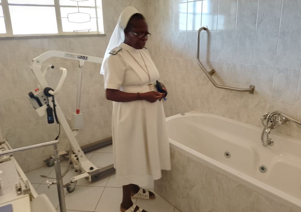 Precious Blood Sr. Caroline Busvumani shows the inside of the hydrotherapy room at the Precious Blood Care Centre.