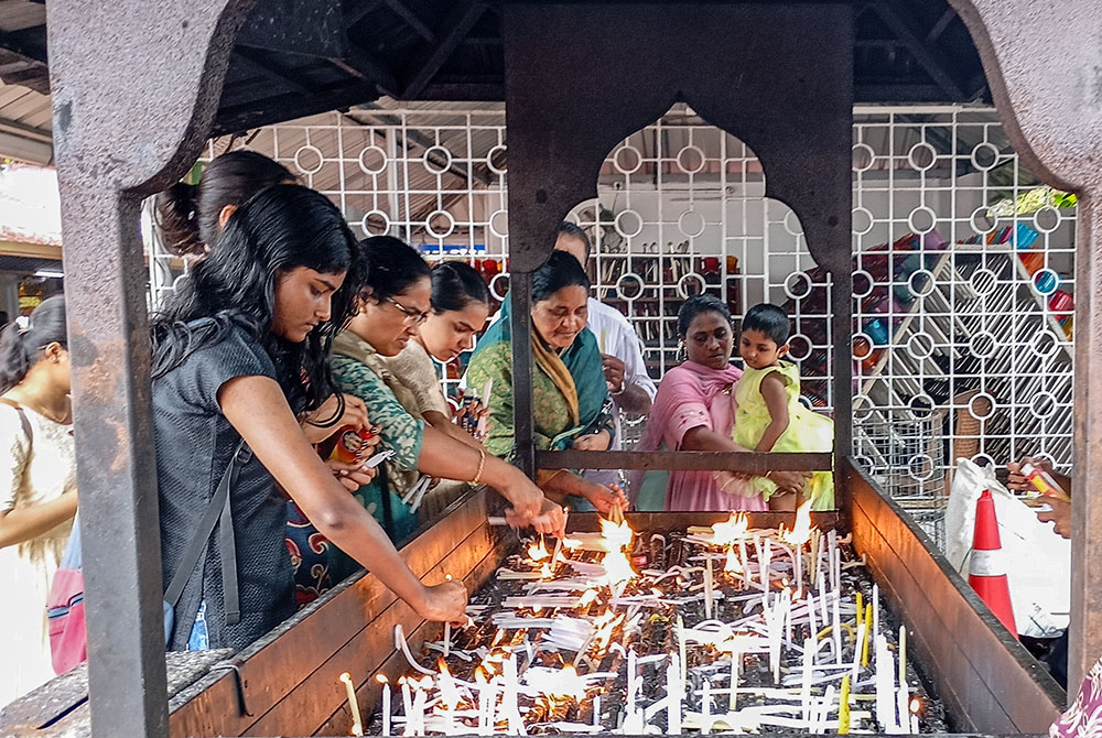 Devotees light candles at the St. Alphonsa Pilgrim Centre in Bharananganam in the Palai Diocese, southwestern India. (Thomas Scaria)