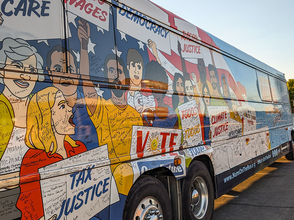 The bus for the Nuns on the Bus & Friends tour, organized by faith-based political advocacy group Network Lobby for Catholic Social Justice, is seen at its Las Vegas stop Oct. 14. (Alecia Westmorland)