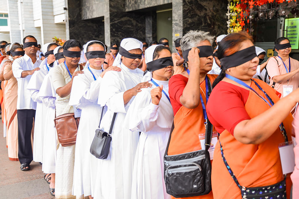 Nuns from the Catholic Health Association of India undertake a blind walk in Bengaluru, India, to spread awareness on eye donation and eye care. (Courtesy of Catholic Health Association of India)