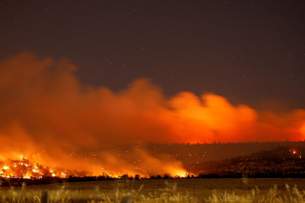 Smoke and flames rise from Park Fire burning near Chico, Calif., July 25. 