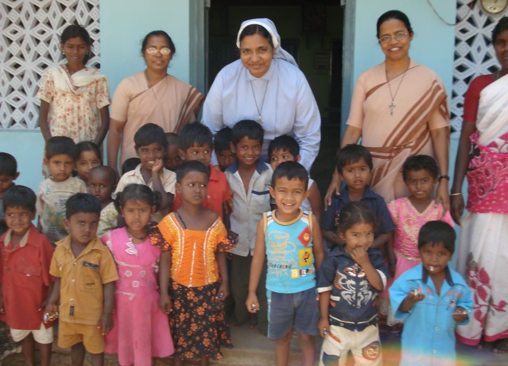 Sr. Maria Goretti and two sisters with newly sponsored children.