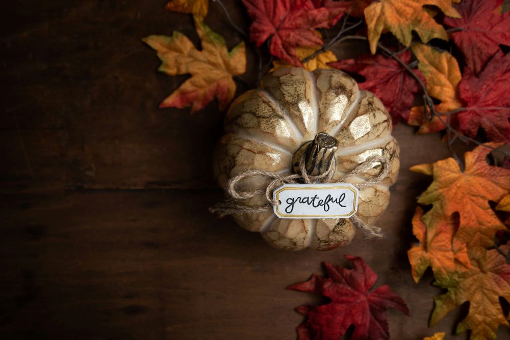 pumpkin with "grateful" sign.