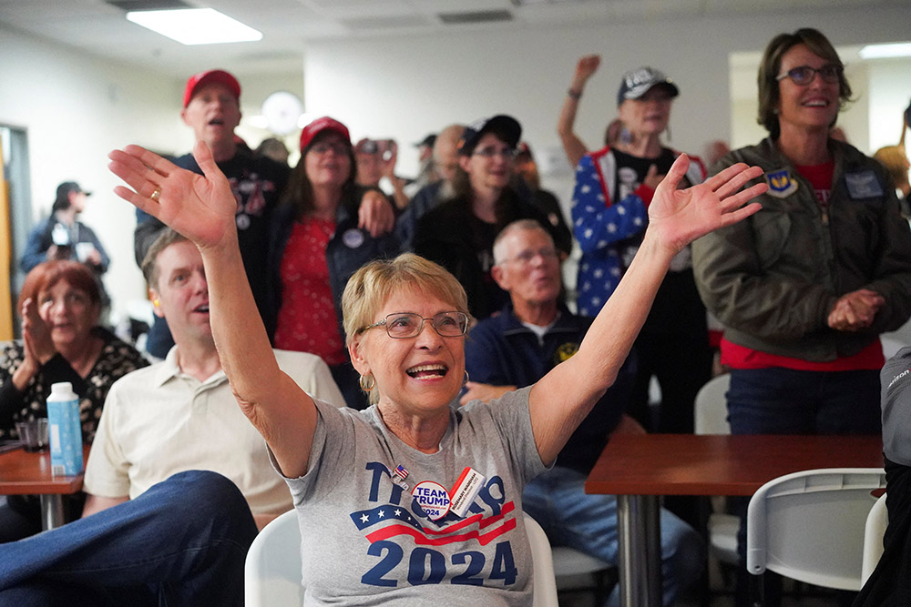 Supporters of Republican President-elect Donald Trump gathered at a Maricopa County Republican Committee election watch party in Arizona react Nov. 6 as Trump speaks from the Palm Beach County Convention Center in Florida after being elected the 47th president of the United States Nov. 5. (OSV News/Reuters/Go Nakamura)