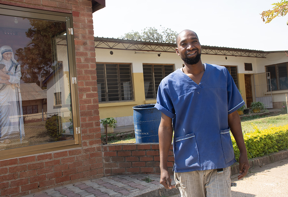 Moffat Tembo, a former patient and now caregiver, enjoys a break after his shift at the admission wards at the Mother Theresa Hospice. (Derrick Silimina)