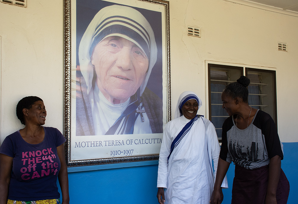 Sr. Mercy Kanyoro shares a light moment with Florence Mulenga, left, and Mervis Mwewa (right). Both women work at the facility and have devoted themselves to giving back what they received from the center when they were in need. Mulenga is in charge of security at the facility after surviving a severe illness. Mwewa works as a tailor and grew up in the facility after she sought refuge as a teenager. (Derrick Silimina)