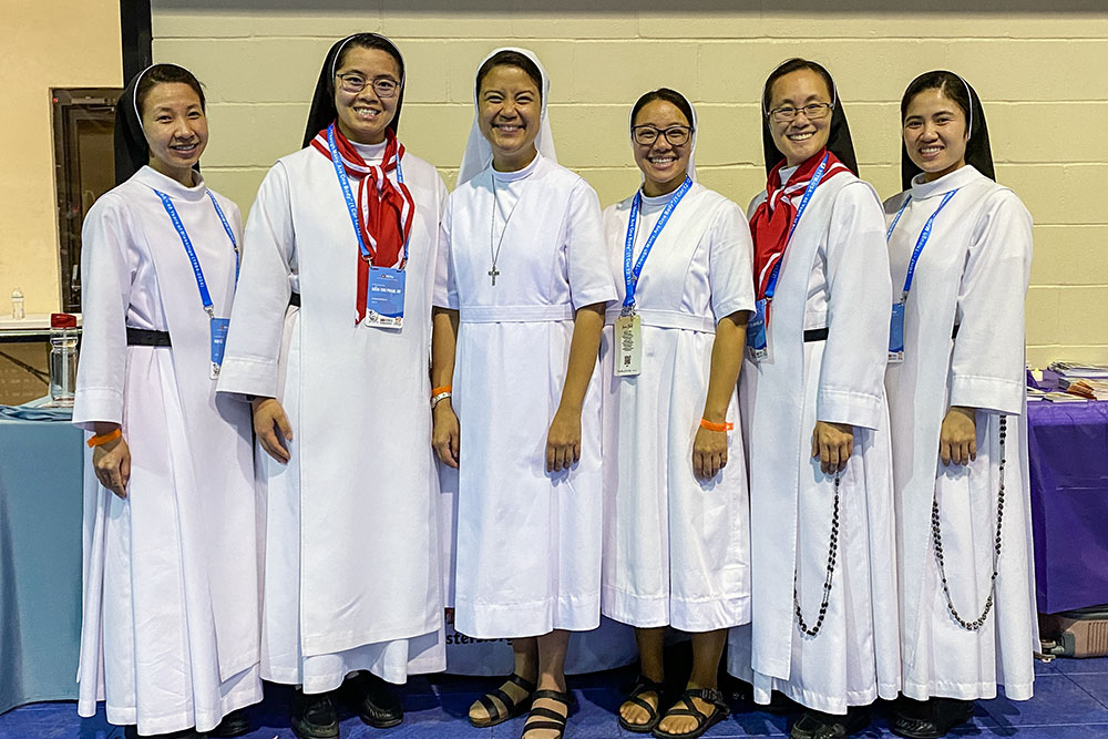 The Salesian Sisters of St. John Bosco and the Dominican Sisters of Mary Immaculate Province joined together to promote awareness of religious vocations at the booths around the main hall. (Catherine Teresa Bui)