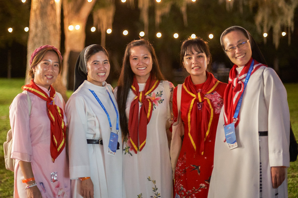 Sisters Rose Martin and Catherine Teresa, both Dominican Sisters of Mary Immaculate Province, join in the festivities with youth leaders during Cultural Night. (VEYM Photography Team via Facebook)