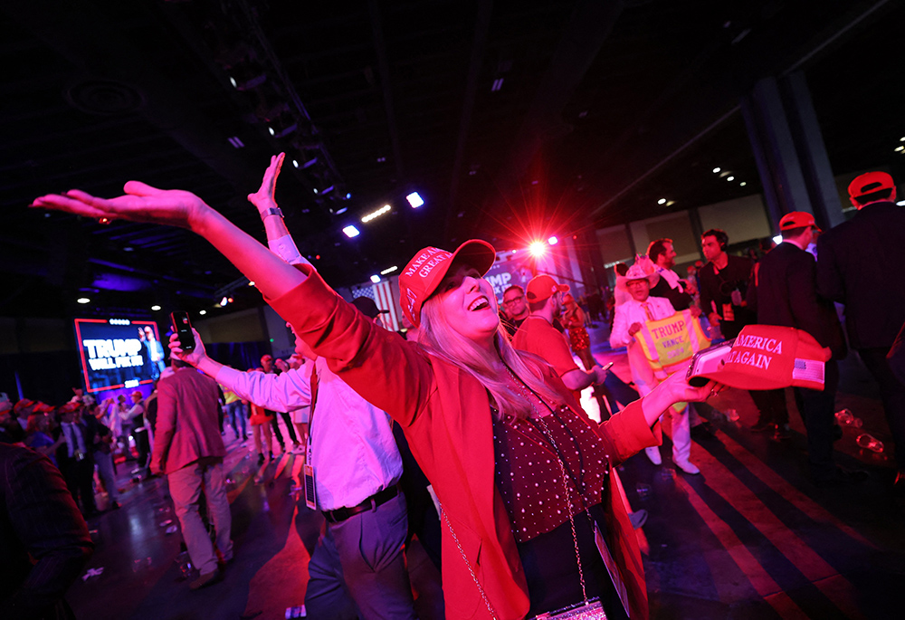 A supporter of Republican President-elect Donald Trump celebrates at his victory rally at the Palm Beach County Convention Center Nov. 6 in West Palm Beach, Florida, after Trump was elected the 47th president of the United States. (OSV News/Reuters/Carlos Barria)