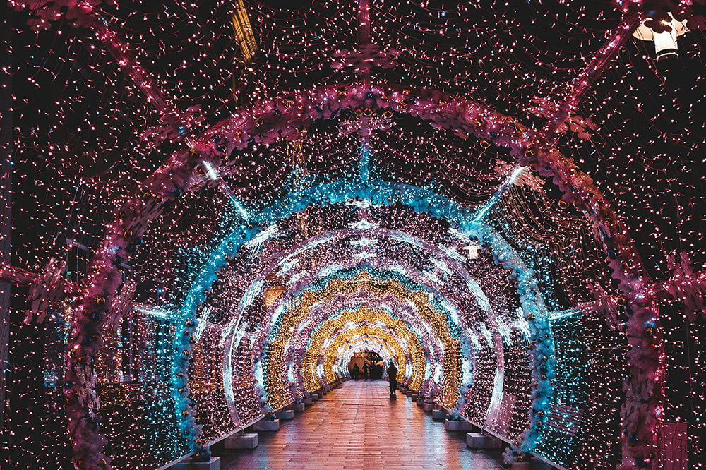 A hallway of Christmas lights (Unsplash/Eric Rai)