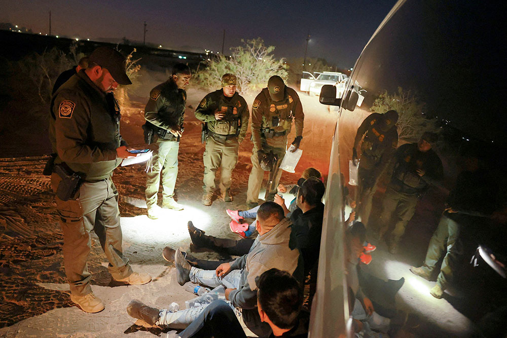 Migrants are detained by U.S. Border Patrol agents in Sunland Park, N.M., Oct. 24, 2024, after they crossed into the United States from Mexico. (OSV News/Reuters/Jose Luis Gonzalez)