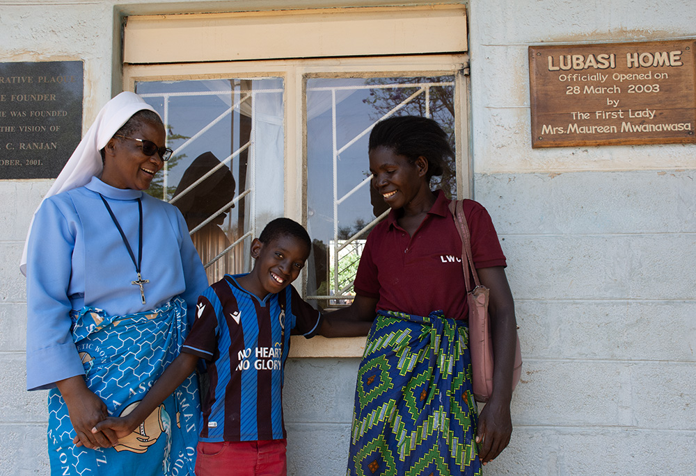 Eneles Phiri, right, connects with her grandchild, Ackray Munsaka, at Lubasi Home in Livingstone. (Derrick Silimina)