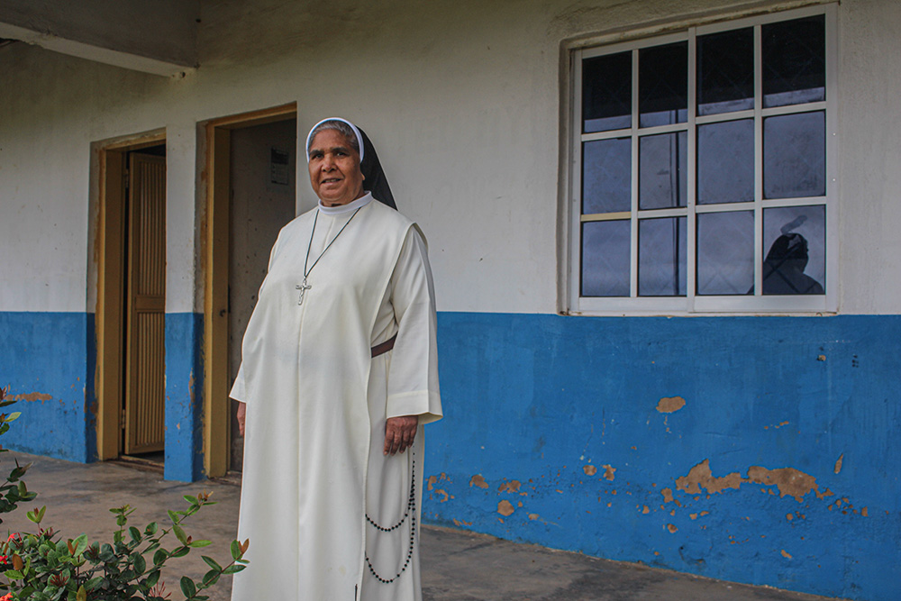 Dominican Sr. Margaret Hussein, the school administrator of Immaculate Heart College, where many girls receive an education, poses for a photo in front of the school in Shendam, Nigeria. (GSR photo/Valentine Benjamin)