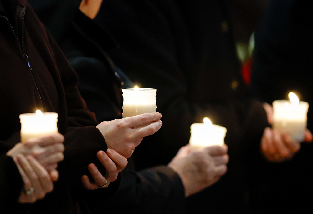 People hold candles at Mass with Pope Francis on the feast of the Presentation of the Lord and the World Day for Consecrated Life in St. Peter's Basilica at the Vatican Feb. 2, 2024. GSR is celebrating the 2025 World Day of Consecrated Life with a special event on Thursday, Jan. 30. (CNS/Lola Gomez)