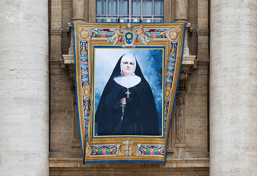 A banner depicting Canada-born Blessed Marie-Léonie Paradis, founder of the Little Sisters of the Holy Family, is displayed outside St. Peter’s Basilica at the Vatican Oct. 17, ahead of her canonization Oct. 20. (CNS/Lola Gomez)