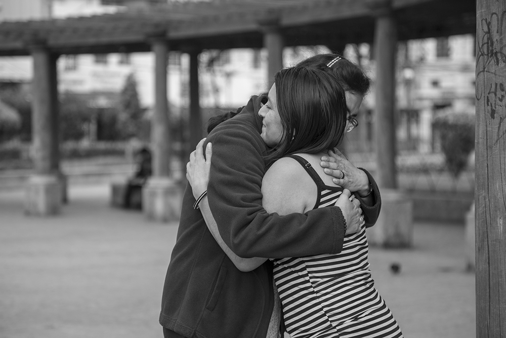 Sr. Angélica Segoviano, left, visits with a woman who once sold sex but has since started working a new job. The two have remained friends. (Courtesy of Lisa Kristine)