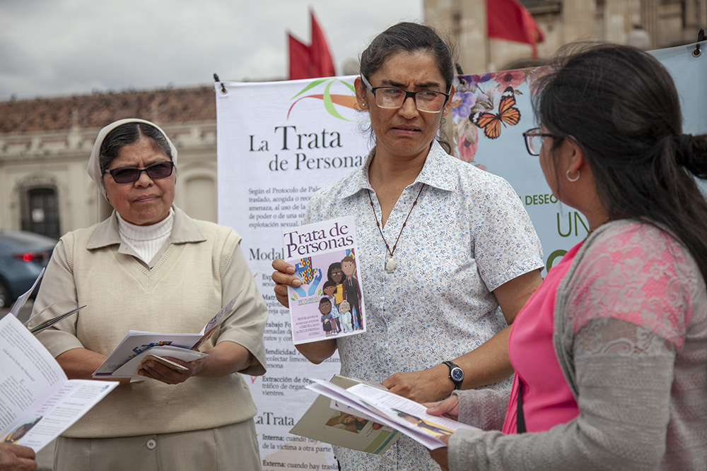 In the public square, Sr. Angélica Segoviano, center, and other local sisters and volunteers set up a demonstration with banners and brochures, handing out information regarding human trafficking. (Courtesy of Lisa Kristine) 