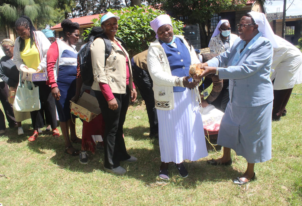 Sr. Florence Muia distributes chicks to her clients in Upendo Village, located in Naivasha, a town northwest of Nairobi, the capital of Kenya. (Courtesy of Upendo Village)