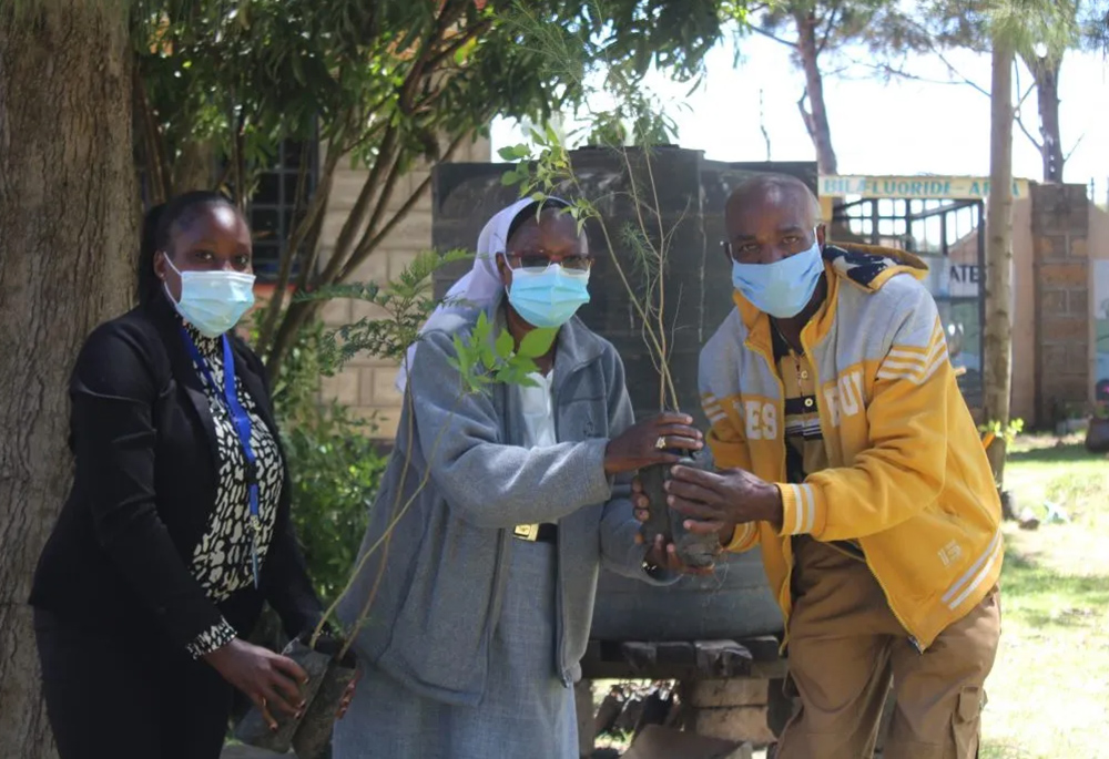 Sr. Florence Muia distributes trees to her clients in Upendo Village, located in Naivasha, a town northwest of Nairobi, the capital of Kenya, as a means of conserving the environment. (Courtesy of Upendo Village)