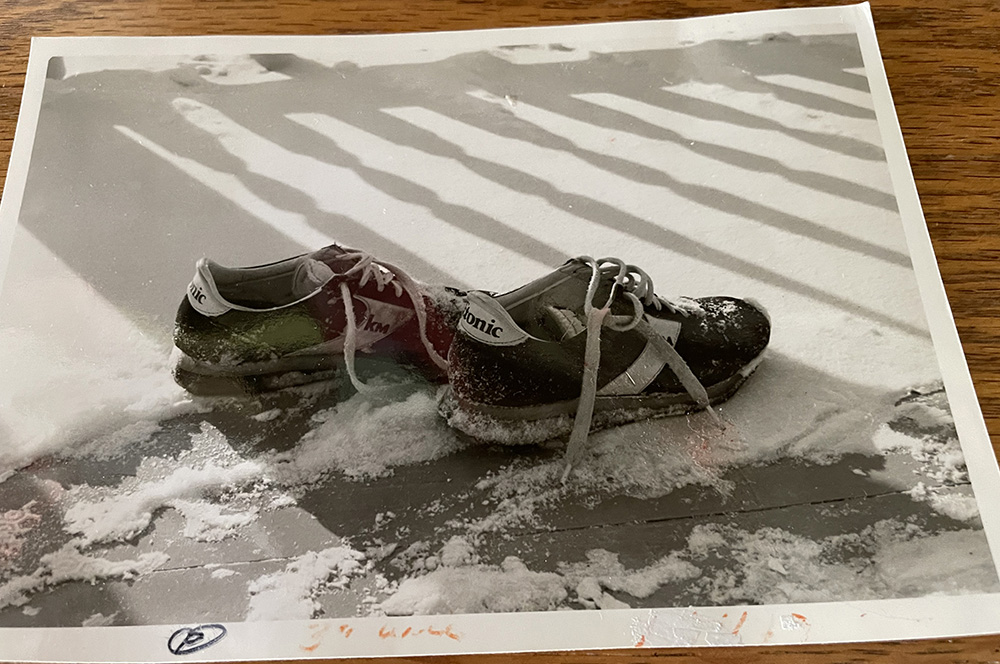 A black and white photo of muddy running shoes taken by Sr. Joan Sauro (Courtesy of Joan Sauro)