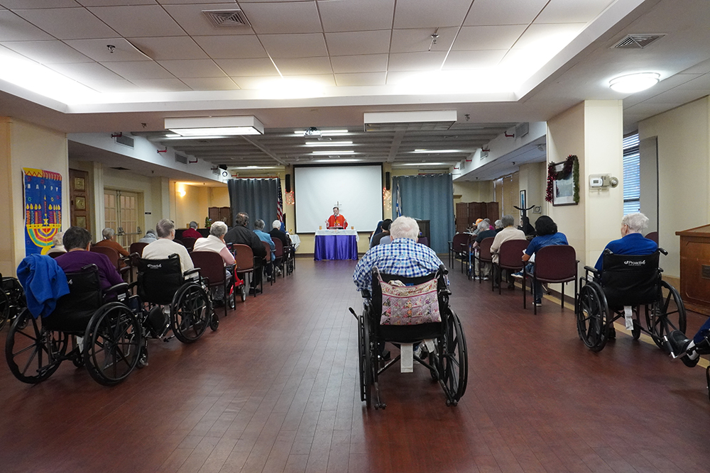 Retired nuns and Jewish residents attend a morning Mass at Kittay New Jewish Home in the Bronx, New York, Dec. 13, 2024. (NCR photo/Camillo Barone)