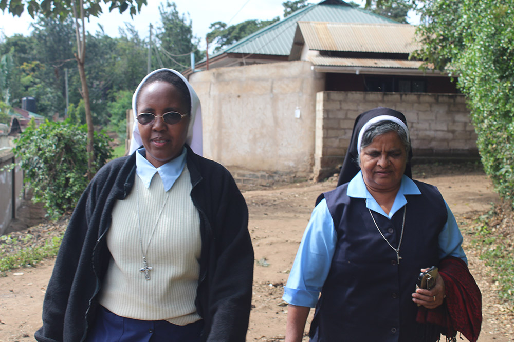 Sr. Kellen Muthoni (front left) and her colleague walk to the villages in Arusha to visit victims of human trafficking in June 2019. (GSR photo/Doreen Ajiambo)