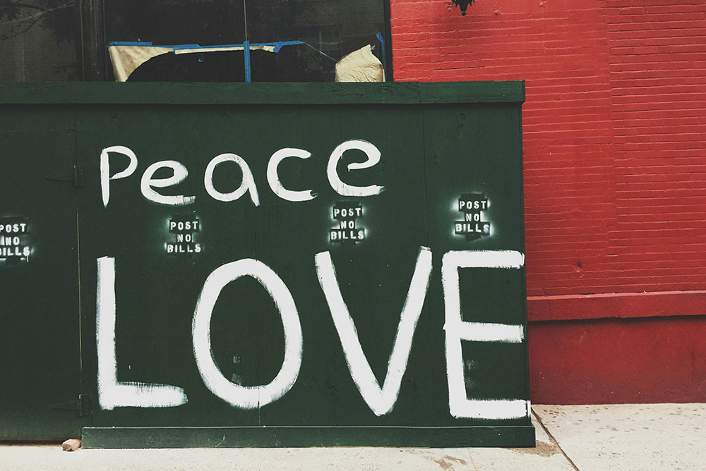 A sign for peace and love (Unsplash/Jon Tyson)