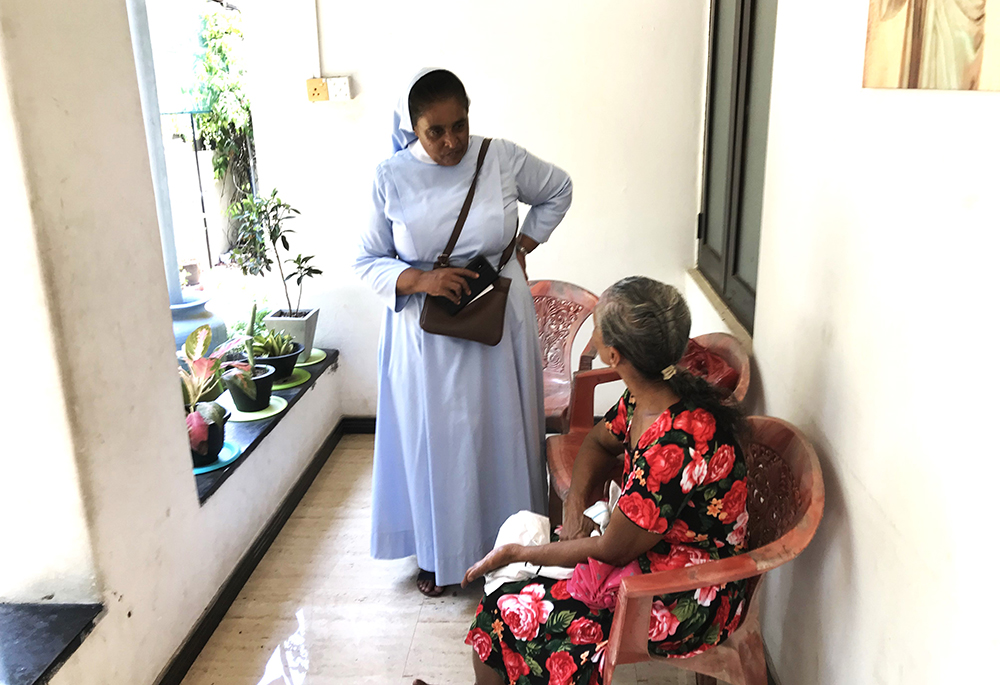 Salvatorian Sr. Princy Fernandopulle interacts with the mother of a resident of her center in Wattala near the national capital of Colombo. (Thomas Scaria)