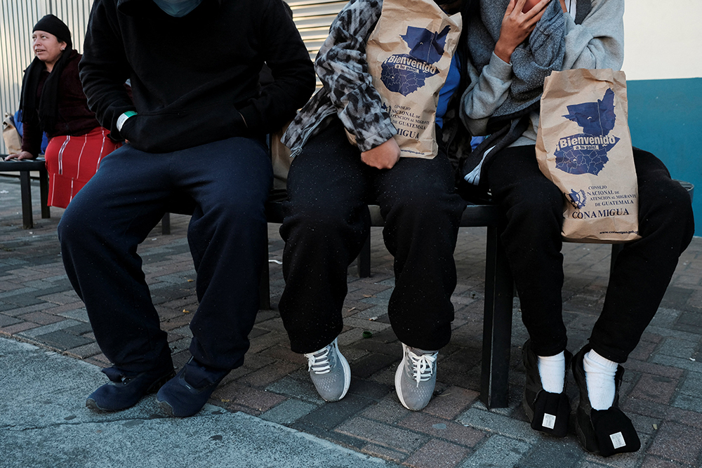 Migrants are seen outside a repatriation center in Guatemala City, Guatemala, after arriving on a deportation flight from the U.S. that landed at La Aurora Air Base Jan. 27, 2025. (OSV News/Reuters/Josue Decavele)