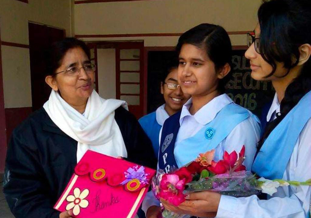 Sr. Nasreen Gian receives a bouquet from grade 10 students at their farewell party at St Mary's Convent School Multan in 2020. (Courtesy of Sr. Nasreen Gian)