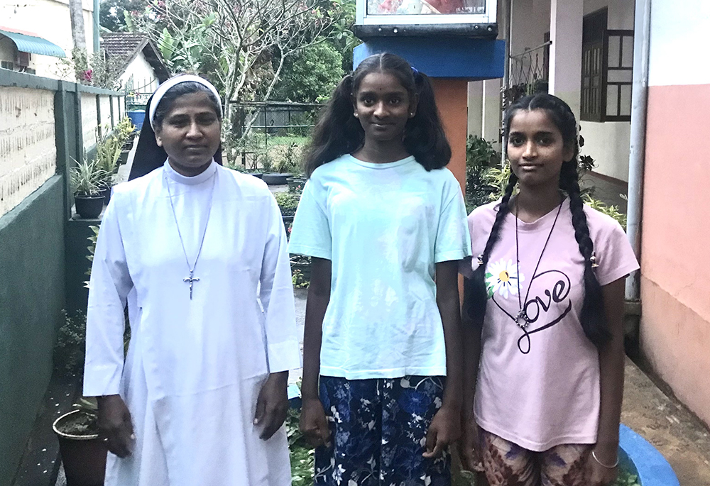 Apostolic Carmel Sr. Maria Pramilda is pictured with two residents of a girls' hostel in Badulla, central province. The hostel is a partner in community-based child care in Sri Lanka. (Thomas Scaria)