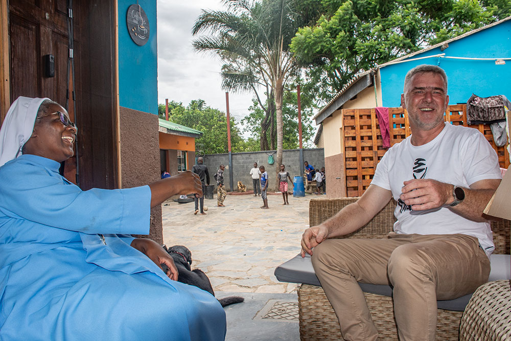 Sr. Catherine Mpolokoso of the Little Servants of Mary Immaculate and Br. Jacek Rakowski of the Missionaries of Africa share a light moment at St. Lawrence Home of Hope in Lusaka, Zambia. (Derrick Silimina)