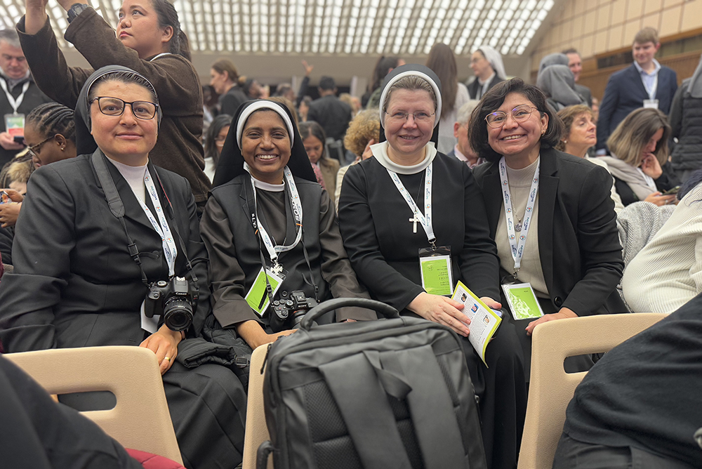 Srs. Rocio Garcia of the Daughters of Mary Immaculate of Guadalupe (Father Plancarte) Mexico, Lismy Parayil of the Congregation of Mother of Carmel of India, Karolina Luczak of the Sisters of the Holy Nazareth from Poland, and Helga Leija of the Benedictine Sisters of Mount St. Scholastica in Atchison, Kansas, in the United States wait for the pope's private audience at the Paul VI Audience Hall Jan. 25, 2025. (Helga Leija)