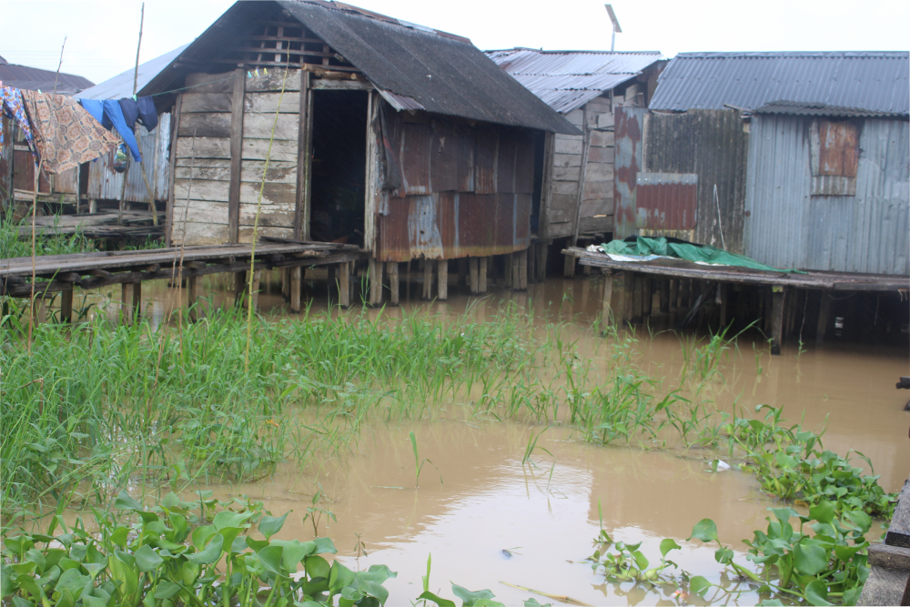 Pontoon houses, built on stilts at the riverbank in Torugbene, are occupied by locals who do not have the financial means to afford houses built with bricks.