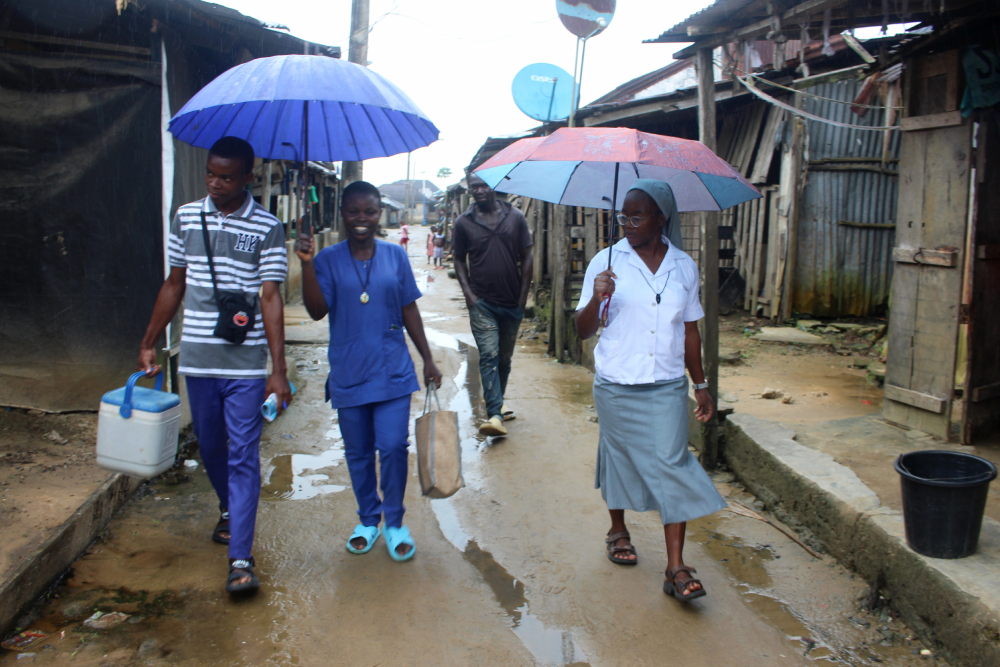 Sr. Janefrances Ihekuna and her team during a free malaria, HIV and syphilis test on a rainy day in Torugbene.