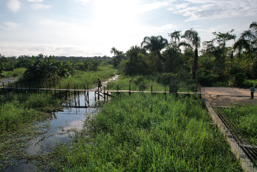 Side view of the wooden bridge linking the Medical Missionaries of Mary sisters' convent, clinic, and the community. The sisters often go into the community to provide sensitization and intervention to the residents. 