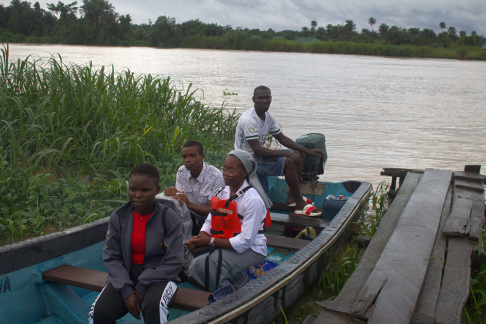 Sr. Janefrances Ihekuna and her team on a boat