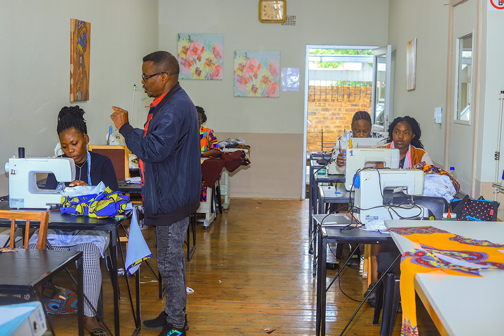 Women refugees take part in a tailoring class at the Bienvenu Shelter in Johannesburg, South Africa, on Oct. 16, 2024. The women at the shelter receive skills training to help them achieve independence and find sustainable employment. (GSR photo/Doreen Ajiambo)