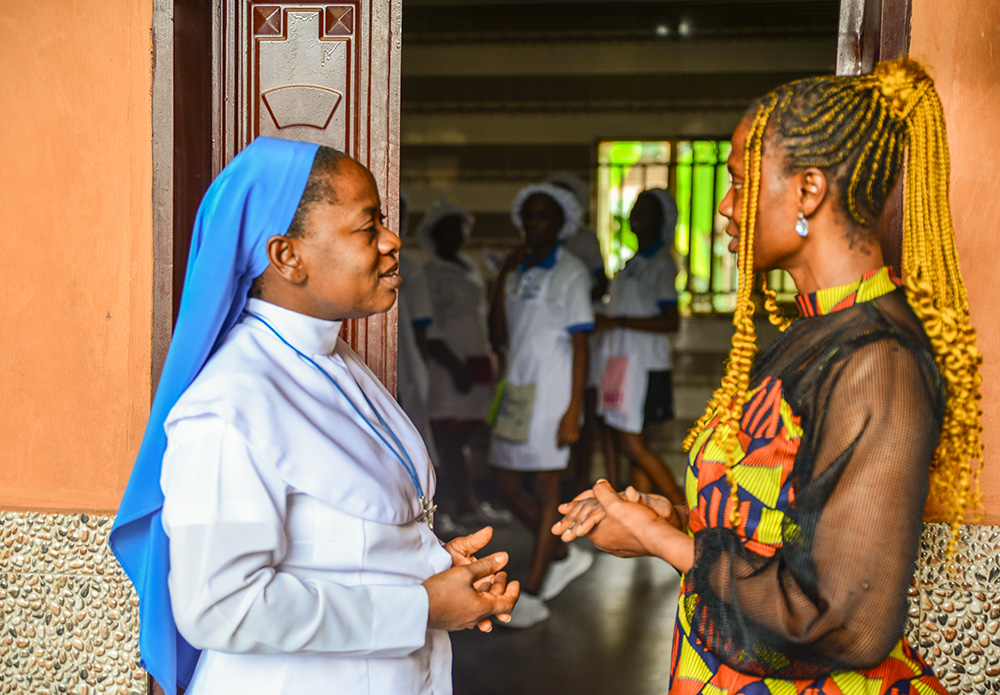 Daughter of Divine Love Sr. Maria Kamdilichukwu Madubuonwu chats with a tutor at the Divino Amore Vocational Institute in Nigeria. (Patrick Egwu)