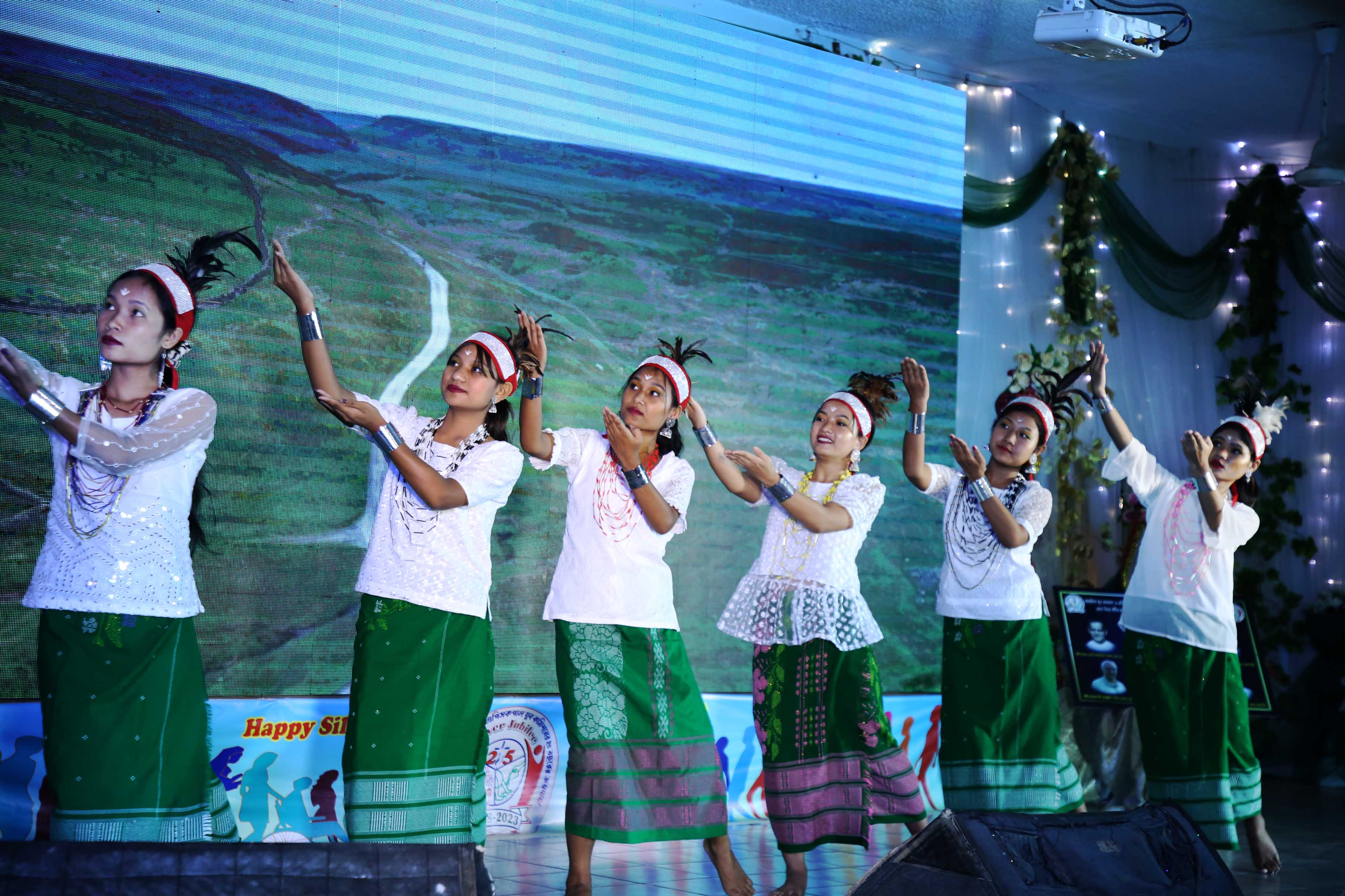 Garo Indigenous girls work to perform a dance with Sr. Lorenza Raffaella Radini at the 25-year program of youth commission at Capital Dhaka.